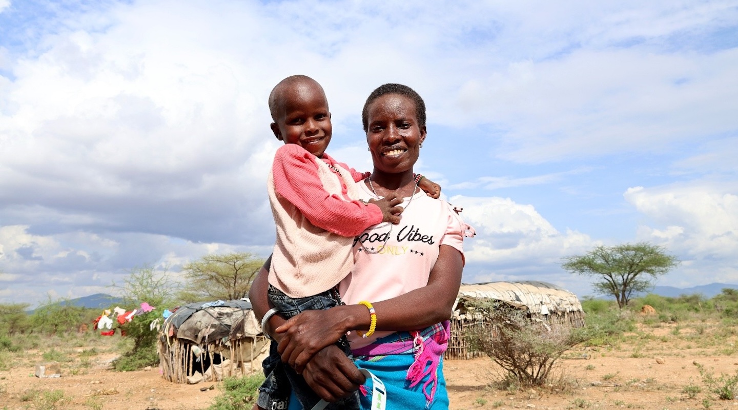 Alesia with her son outdoors in Kenya.
